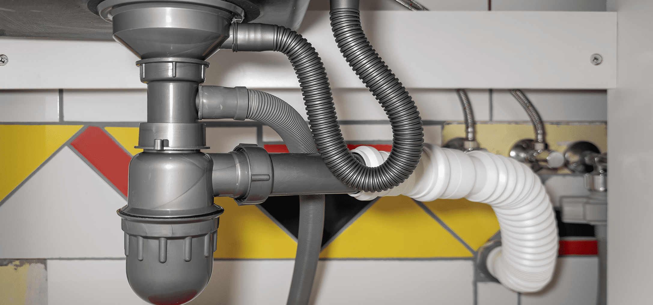 Under-sink plumbing pipes and fittings