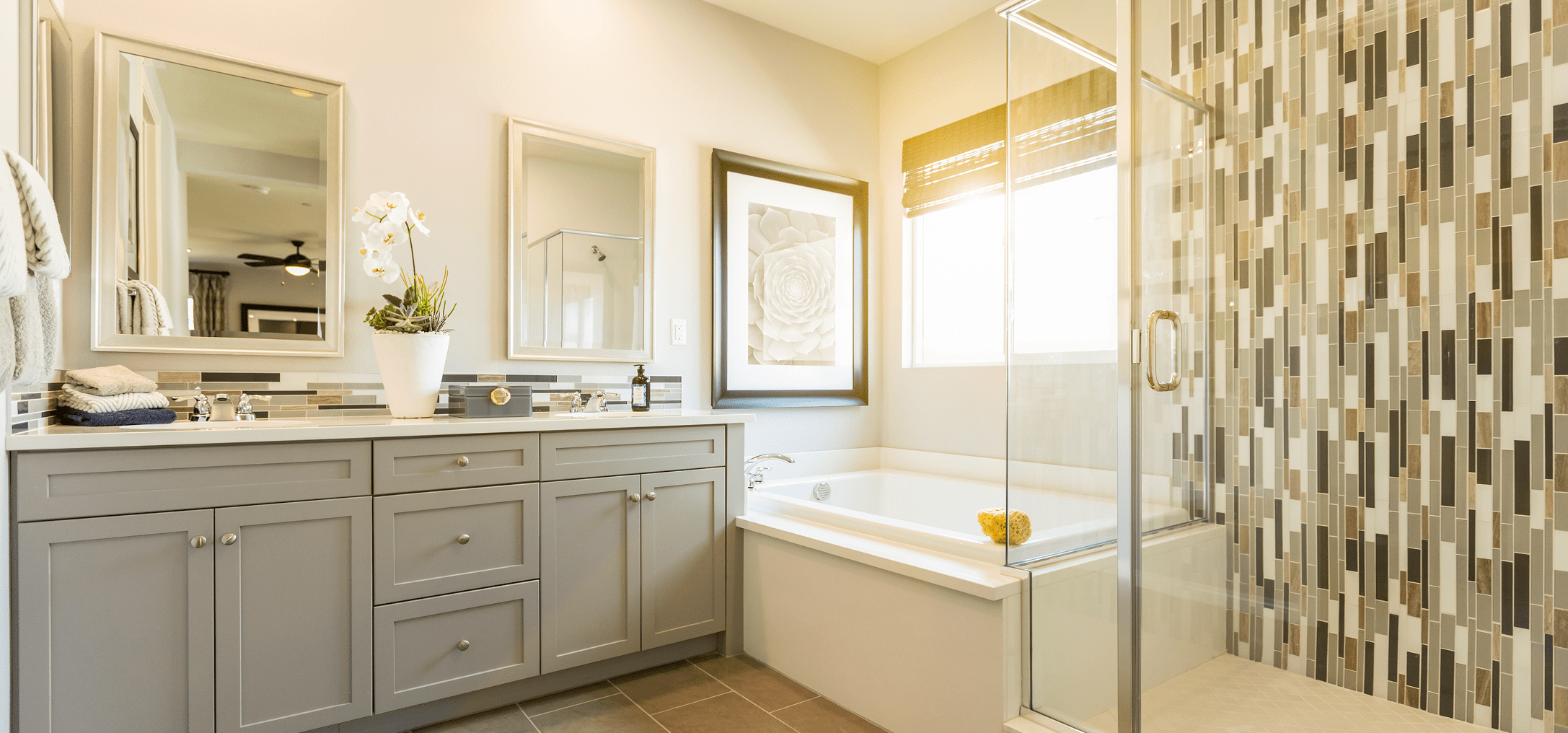 Spacious bathroom featuring large mirrors